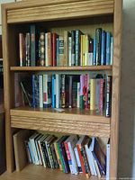 Full view of three shelves containing all books in lot