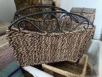 Seagrass basket with metal frame over other baskets