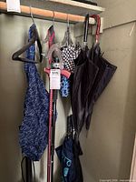 Umbrellas hanging on rack, cane, umbrella hangers