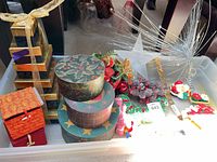 Tray with gift boxes, ornaments, star toppers, tinsel picks