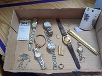 Overview of all wristwatches, necklace, rings, band in box