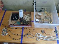 Overview of lot on table with box and bin