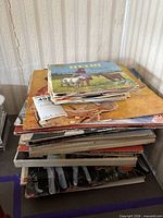 Stack of records showing quantity and varied cover art