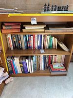 Front view showing full bookshelf structure and three shelves