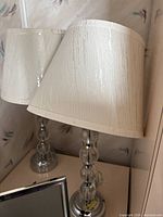 Both lamps showing design, shades, and chrome bases