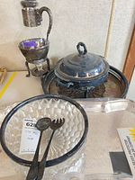 Overall lot showing urn, chafing dish, tray, glass bowl and utensils