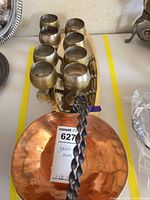 Goblets arranged on brass tray with copper basket visible