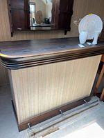 Full view of bar front, top surface, mirror back visible