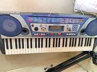 Full view of Yamaha PSR-260 keyboard on stand