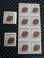 Block of eight and one single Churchill 5¢ stamps on polka-dot background