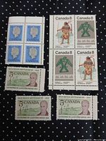 All stamps laid out on dark dotted background showing blocks and singles