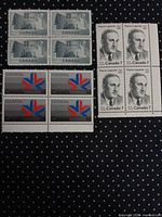 All three blocks of stamps laid out on black background