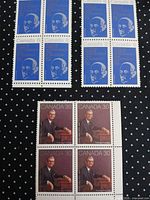 Full view showing three stamp blocks: two blue 8¢ and one brown 30¢
