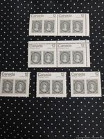 Seven joined pairs of Canada CAPEX 1978 12¢ stamps on dotted background