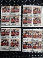Four blocks of four 15¢ J. E. H. MacDonald Canadian stamps on dotted background