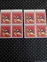 Full view of two blocks of four Canadian 30¢ Christmas Noël Nativity stamps