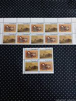 Full view of sheet of 10 and block of 4 stamps