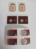 All eight stamps arranged: two 5¢, two 32¢, four 34¢
