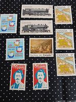 All 10 Canada stamps displayed on black cloth with white dots