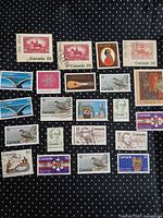 All 22 Canadian stamps laid out on dotted background