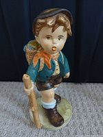 Front view of ceramic boy figurine