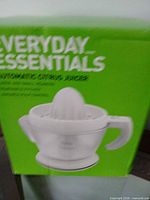 Retail box front showing Everyday Essentials Automatic Citrus Juicer image