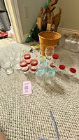 Full lot showing all glassware pieces grouped on floor