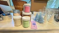 Assorted jar candles and tree candles on tabletop