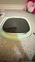 Top view of collapsible washer with black lid closed