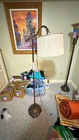 Full view of metal floor lamp with shade attached