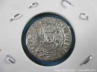 Obverse of silver solidus coin in holder