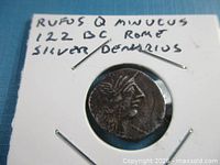 Obverse of silver denarius in cardboard flip, handwritten label visible