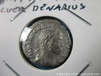 Obverse of Trajan silver denarius in flip