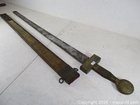 Sword and scabbard side by side, full length