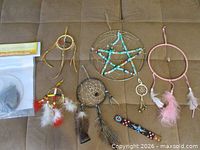 Group shot of six dream catchers, wristband, medicine wheel kit