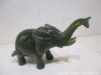 Side view of dark green jade elephant