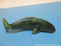 Left-side view showing overall whale form and drilled tail hole