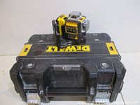 Laser level positioned atop TSTAK case