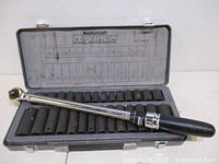 Open case showing all 21 sockets and torque wrench
