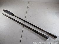 Two spear heads full length view