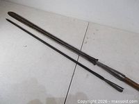 Overall view of both spearheads showing length and design contrast