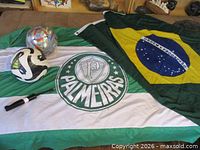 Brazil national flag, Palmeiras flag, two soccer balls, Nike pump