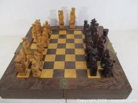 open chess set on folded board showing pieces