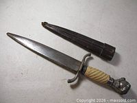 Full dagger and sheath showing overall form and size