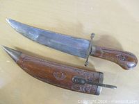 Full view of dagger and sheath showing overall design and materials
