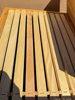 Top view of wooden frames inside hive body