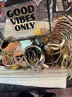 Top view of clear cosmetics bag filled with assorted jewelry