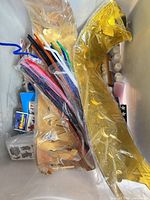 Overview of tote with crowns, pipe cleaners, stickers, paints