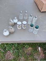 Overview of all salt and pepper shaker pairs arranged on table