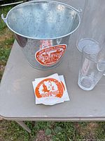 Shows Sly Fox ice bucket, sticker sheet, part of pint glass